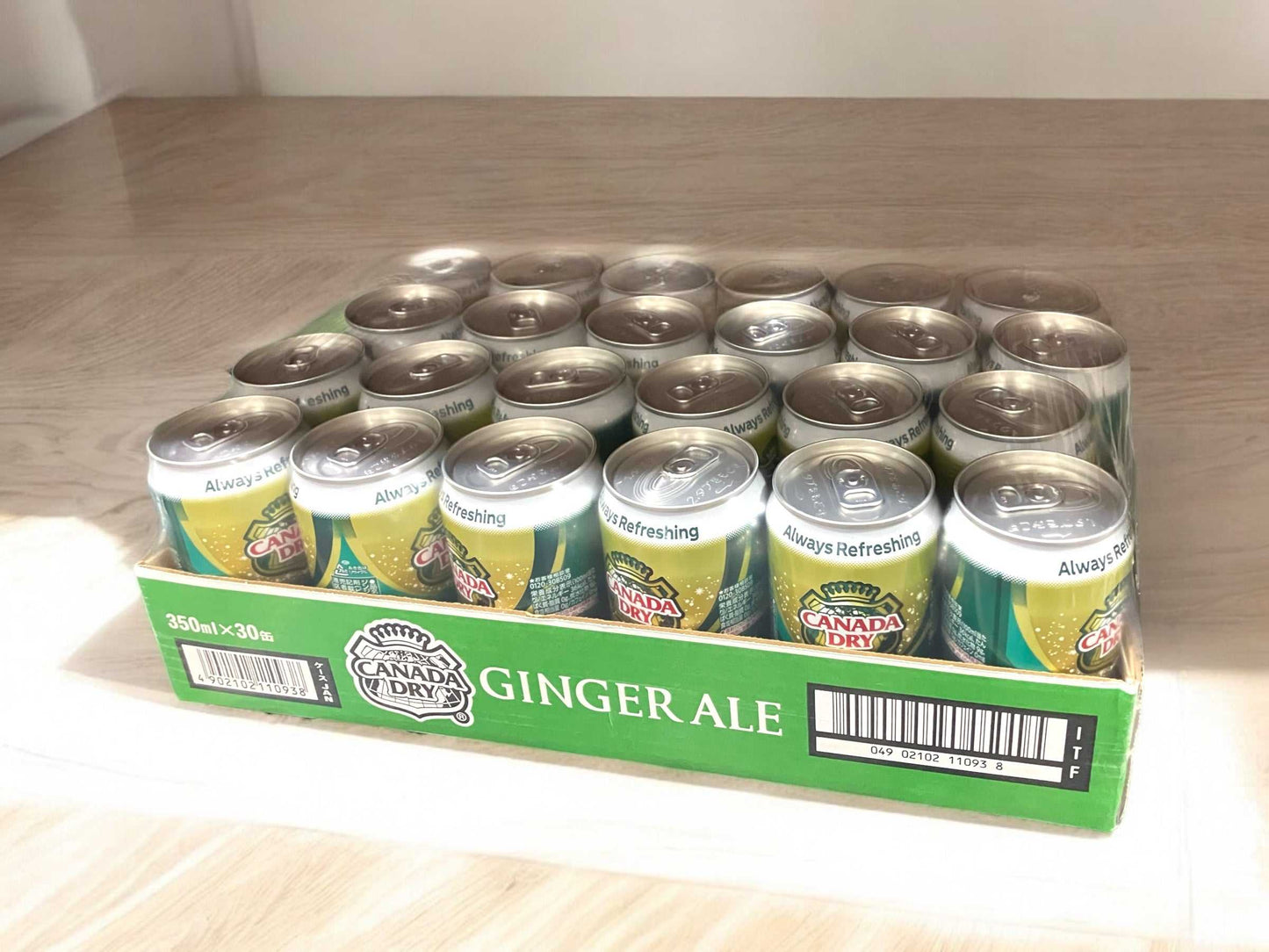 30-pack of 350ml Canada Dry Ginger Ale cans with refreshing dry taste in green packaging
