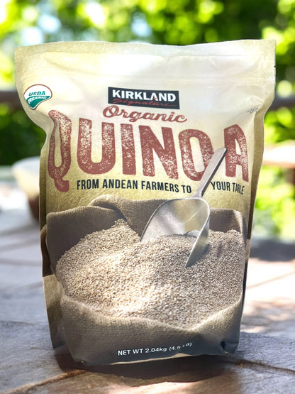 Kirkland Signature Organic Quinoa 2.04kg packaging on outdoor table.