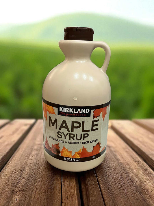 Kirkland Signature 1L pure Canadian maple syrup bottle with amber color and rich taste on wooden table